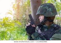 female-soldier-military-uniform-holding-450w-1116642980.jpg